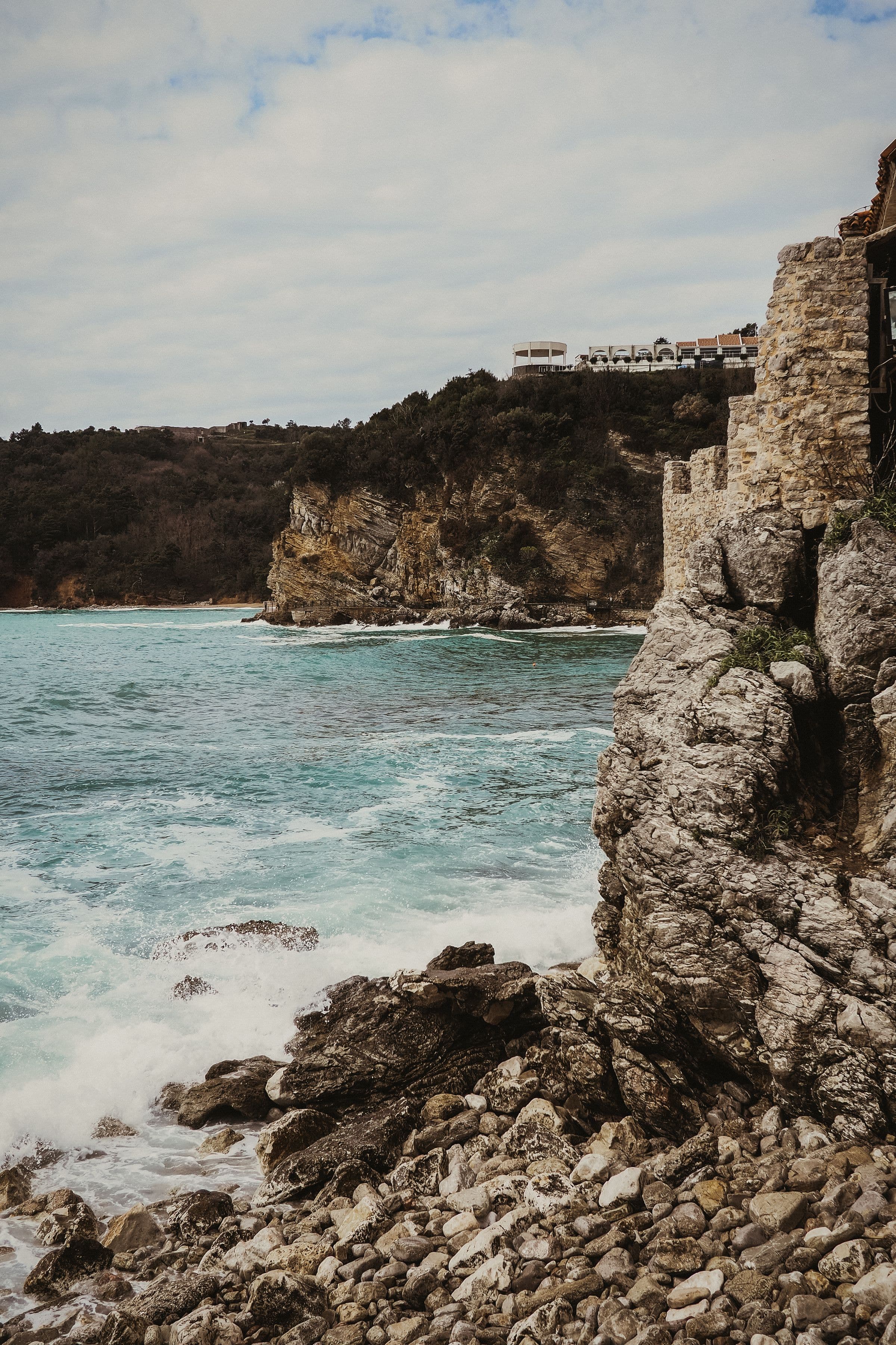 Rocky cliffs and turquoise sea near the cave
